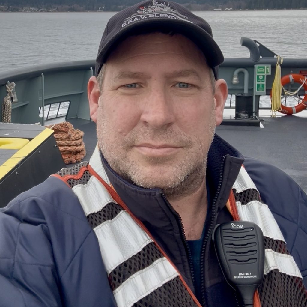 Ryan Simmonds wearing a lifejacket on a ship